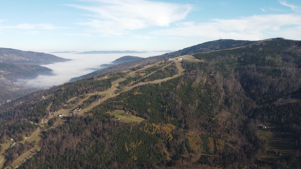 an aerial view of a road in the mountains