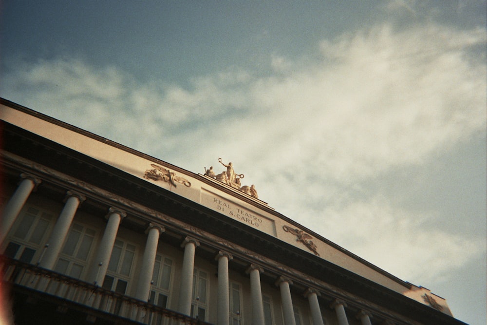 a building with columns and a sky background