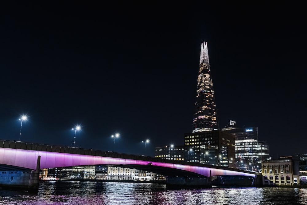 a bridge over a body of water at night