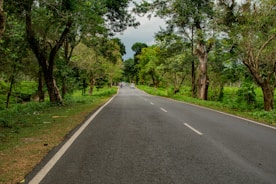 A serene road scene with vehicles driving safely.