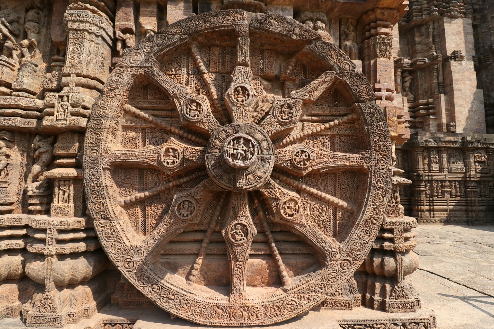 a large wheel on the side of a building