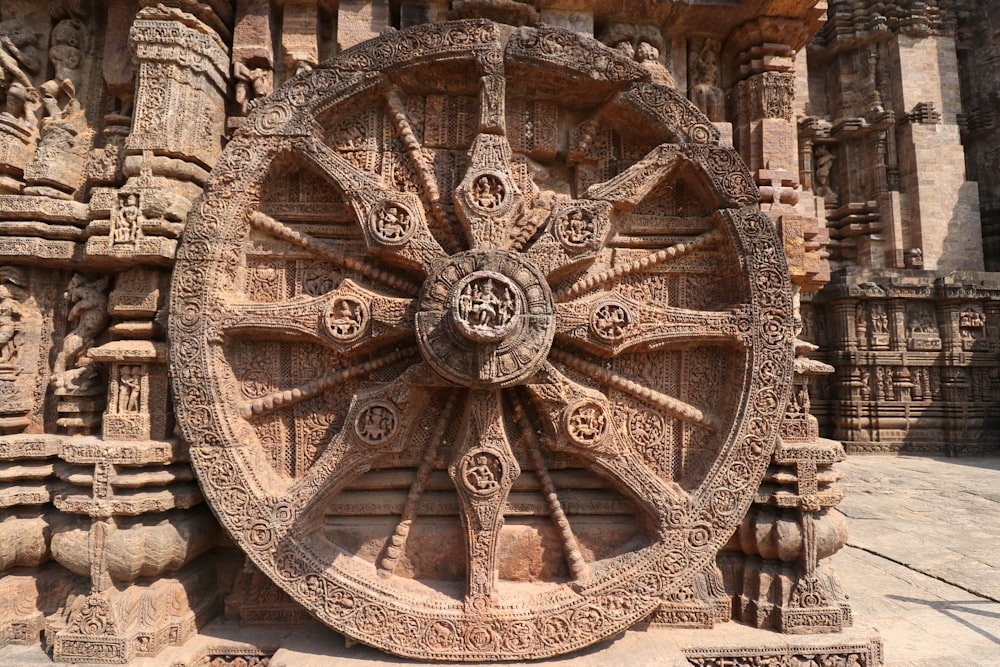 a large wheel on the side of a building