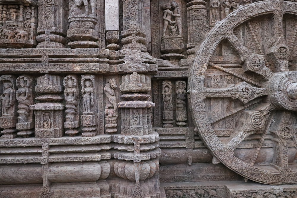 a large wheel on the side of a building