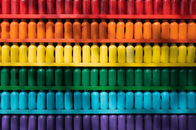 Close-up of colorful laboratory reagent bottles neatly arranged on a shelf