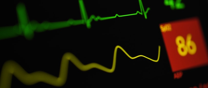 a close up of a monitor screen with a heart beat