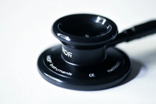 a close up of a black object on a white surface