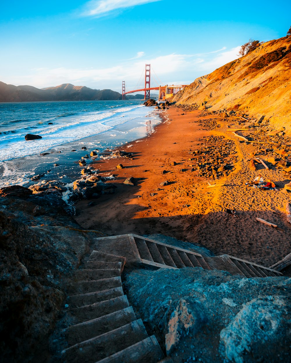 a view of the golden gate bridge from the beach