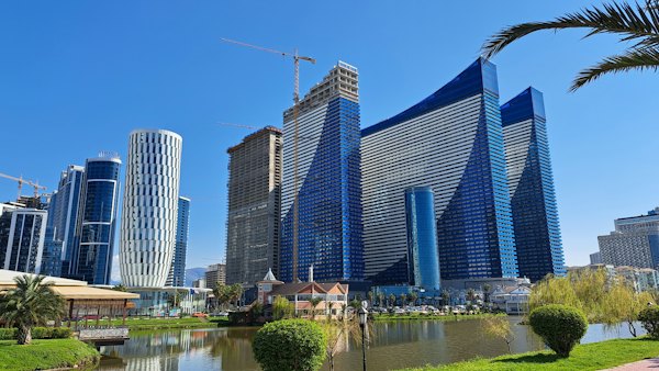 A city with tall buildings next to a body of water — Batumi, Georgia