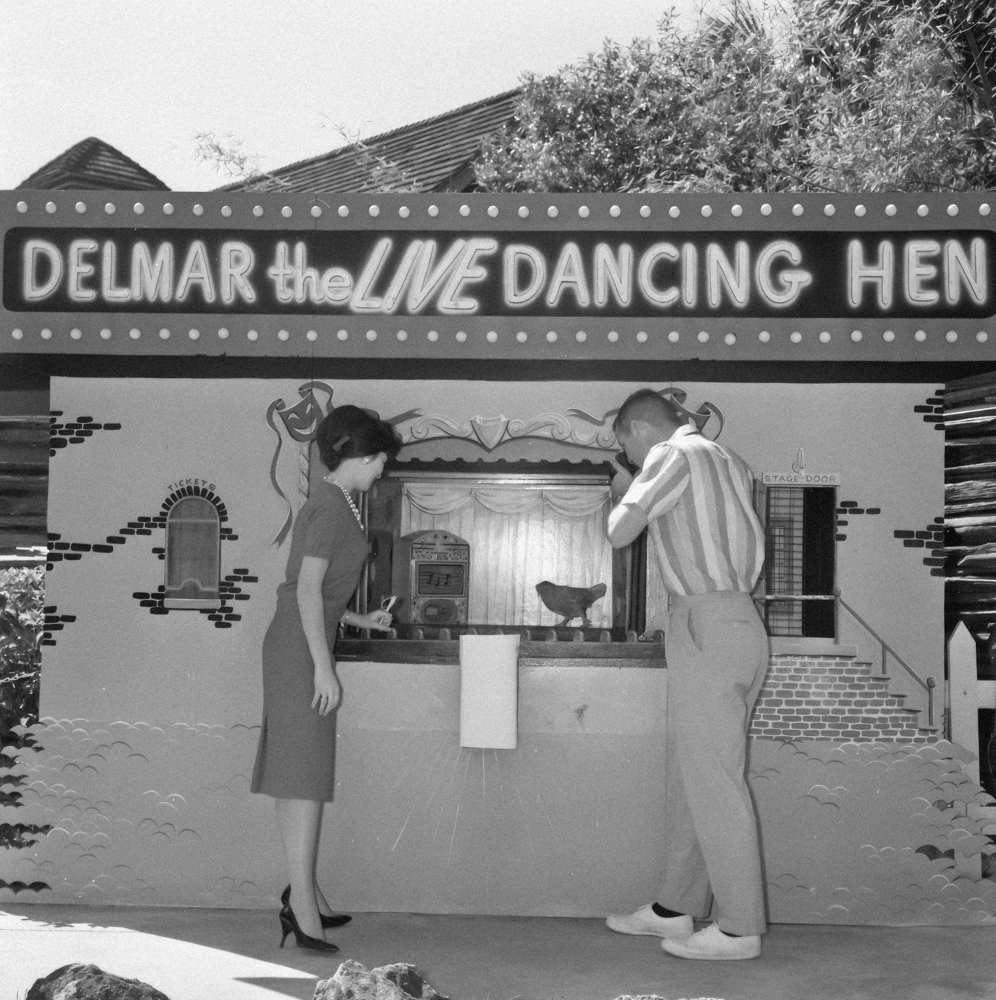 patrons at a snack kiosk, dressed for an evening out