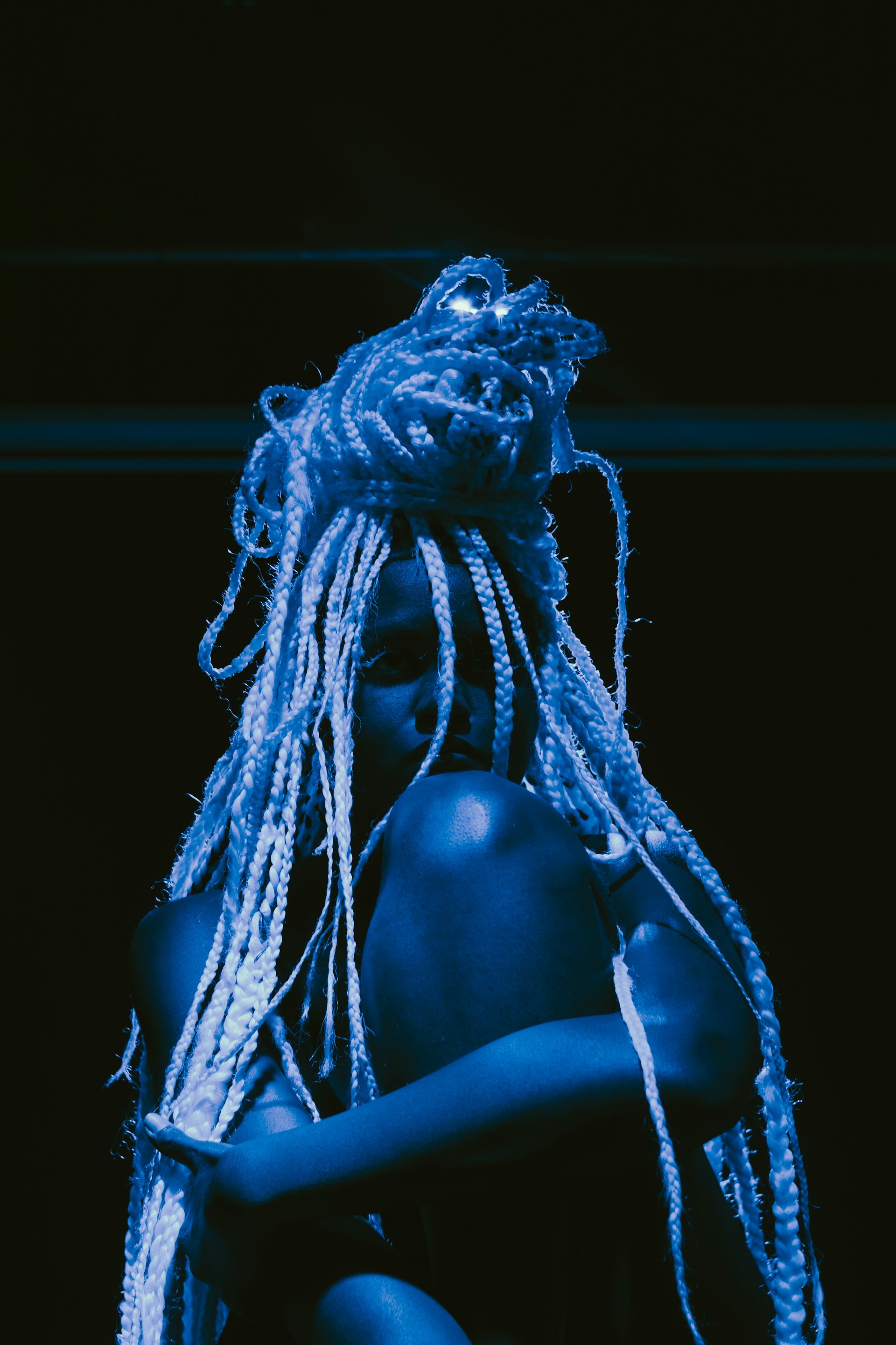 woman wearing yellow long-sleeved dress under white clouds and blue sky during daytime