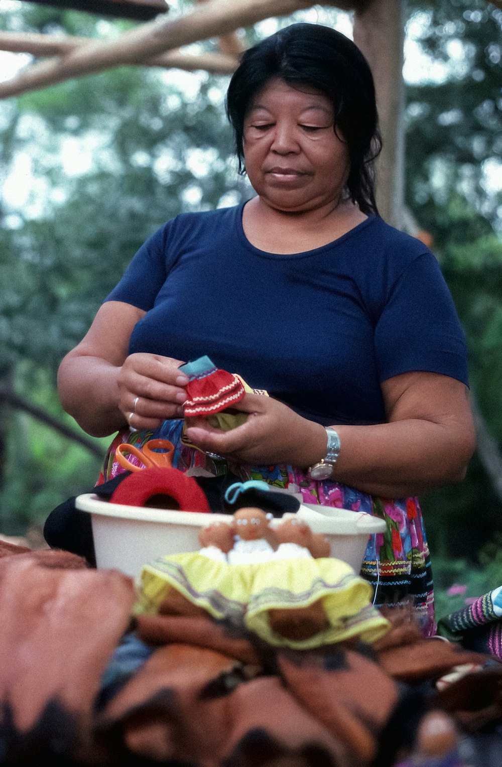 a woman holding a bowl of food in her hands