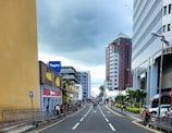 a street lined with tall buildings next to tall buildings