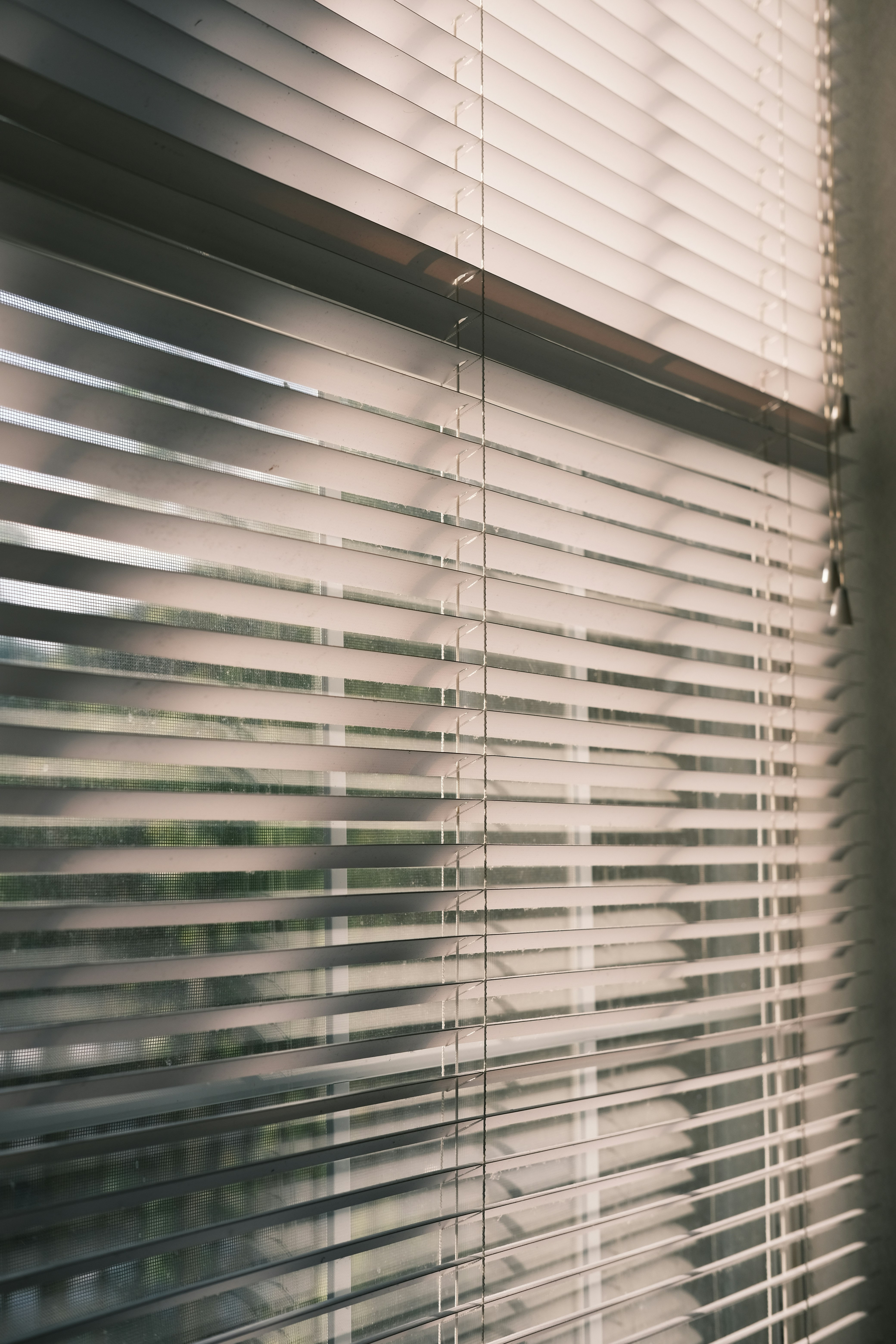 a close up of a window with blinds on it
