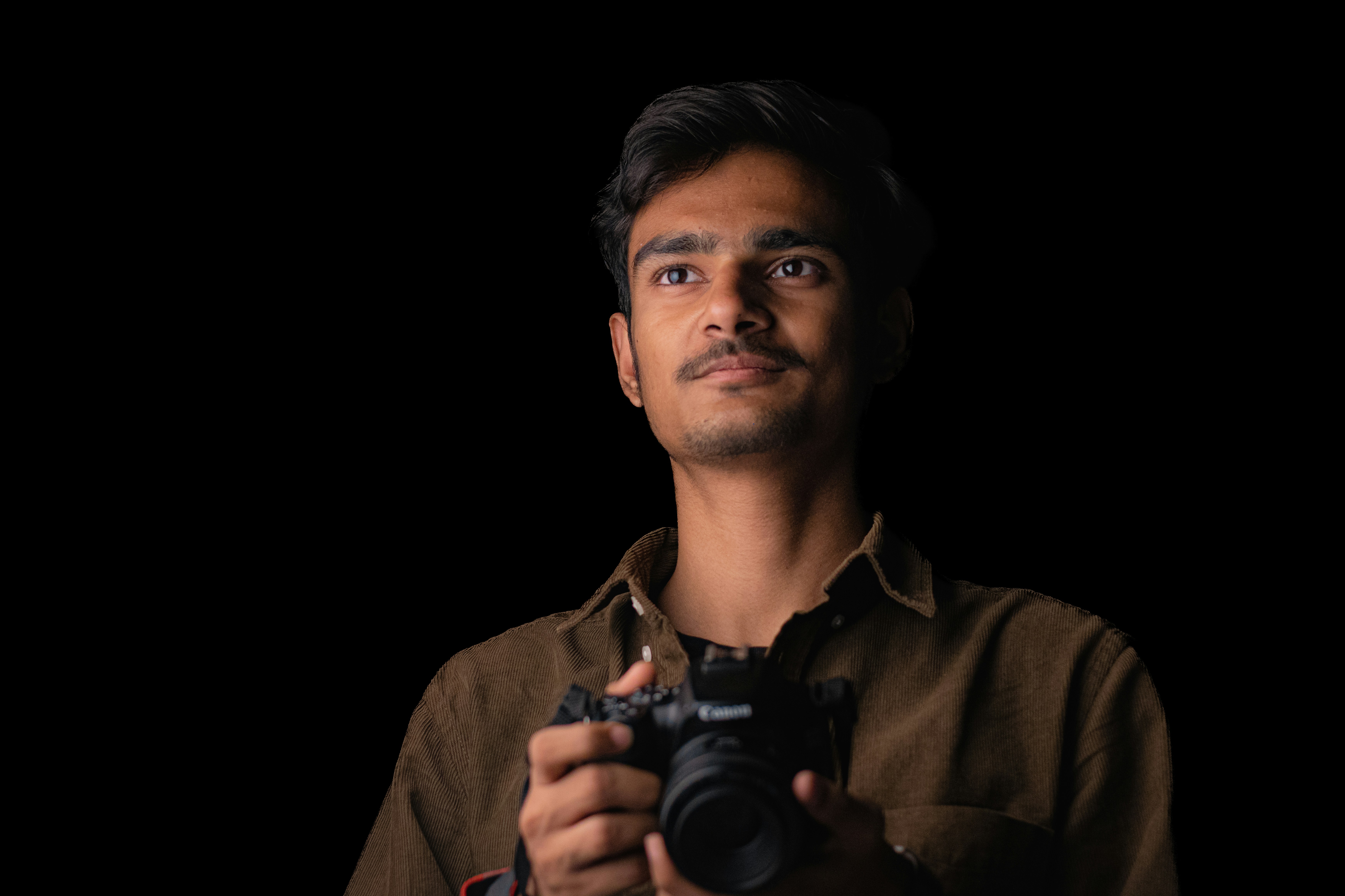 a man holding a camera in his hands