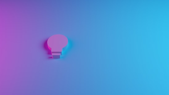 A dark-themed, minimalistic illustration featuring a shield, a glowing lightbulb, and a winding path symbolizing protection, ideas, and the journey ahead.