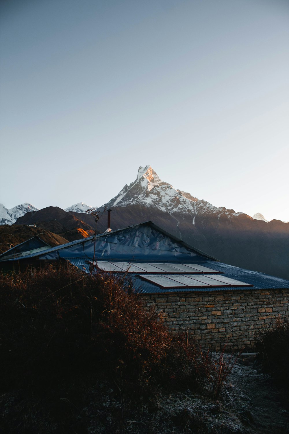 a house with a mountain in the background