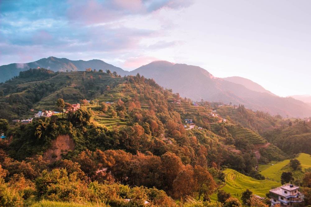 a scenic view of a mountain with houses on it