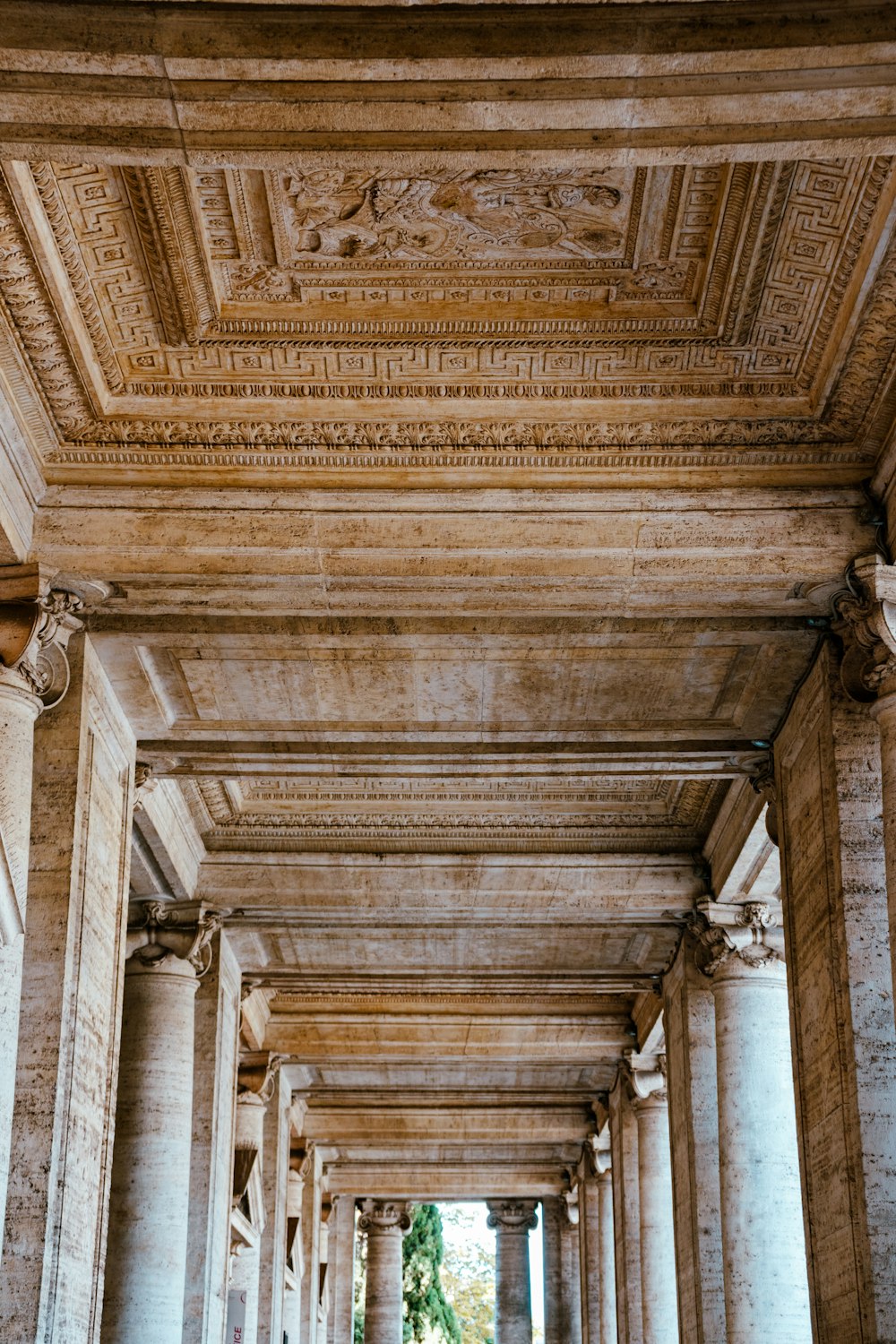 a row of pillars with a clock on each of them