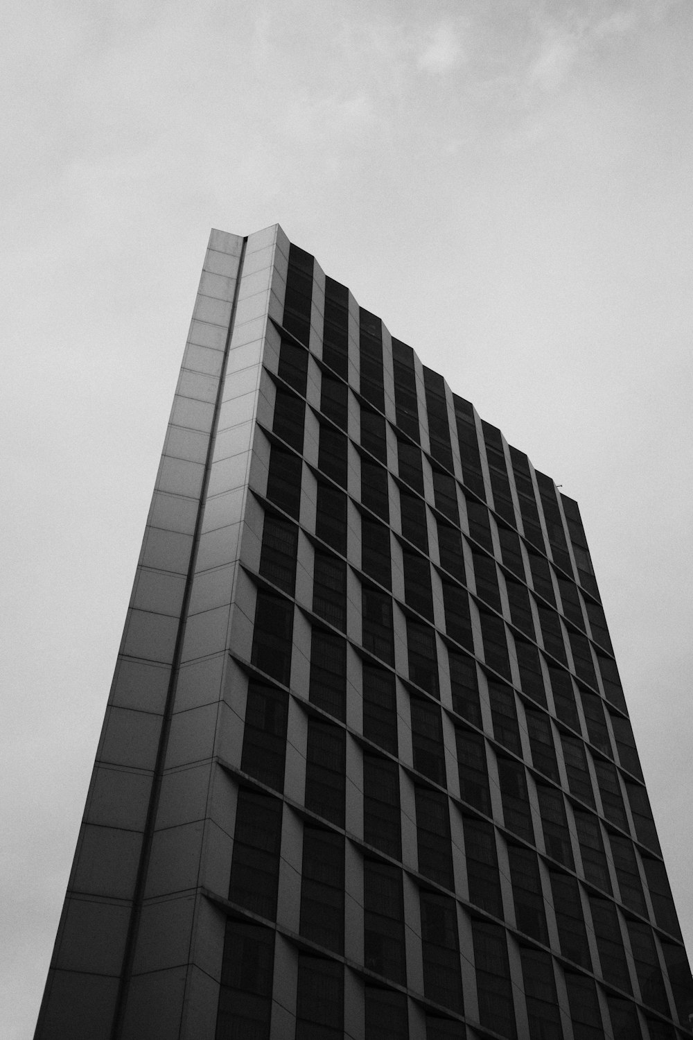 a black and white photo of a tall building