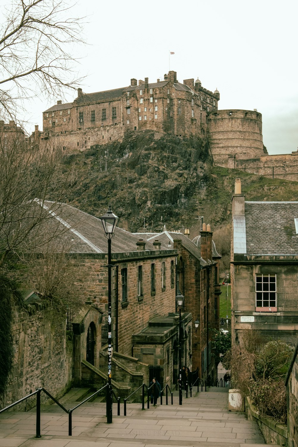 a stone building with a castle on top of it