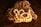 A string of pearls is elegantly draped over what appears to be a piece of textured organic material, possibly a mushroom or fungus, placed against a richly colored, dark golden-brown background. The pearls have a soft, creamy luster.