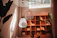 A cozy living room softly lit by a glowing geometric pendant light hanging above a wooden coffee table.