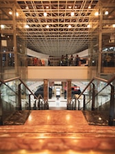 a group of people walking up and down a set of stairs