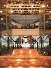 a group of people walking up and down a set of stairs