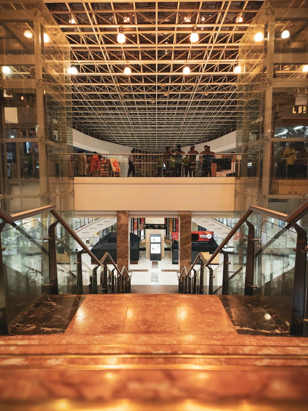 a group of people walking up and down a set of stairs