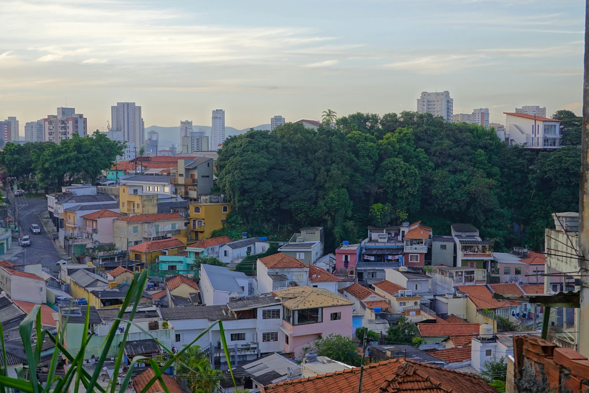 A panoramic shot of a vibrant neighborhood highlighting various properties and community amenities.