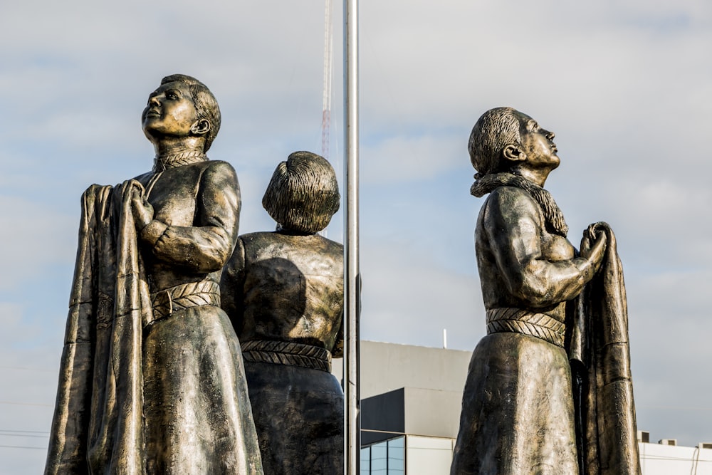 a statue of a woman and a child holding a flag
