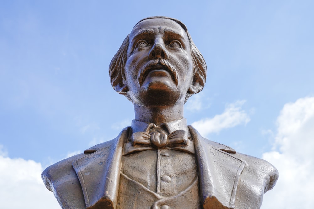 a statue of a man wearing a suit and bow tie