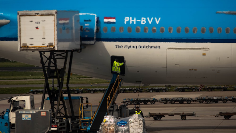 a large passenger jet sitting on top of an airport tarmac