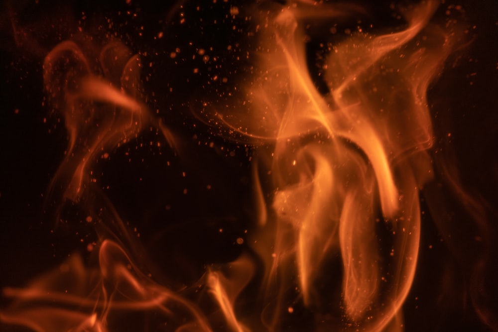 a close up of a fire on a black background