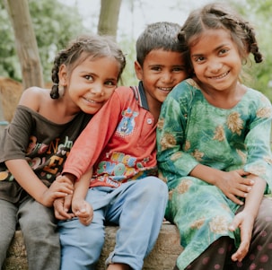 a group of children sitting next to each other