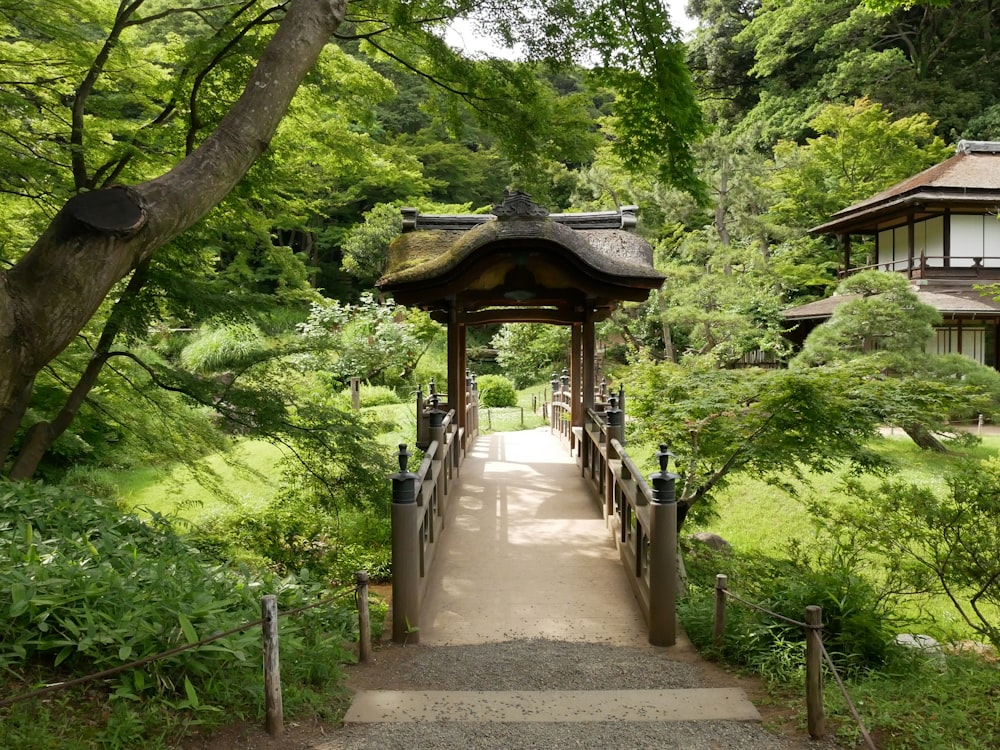 a path leading to a pavilion in a park