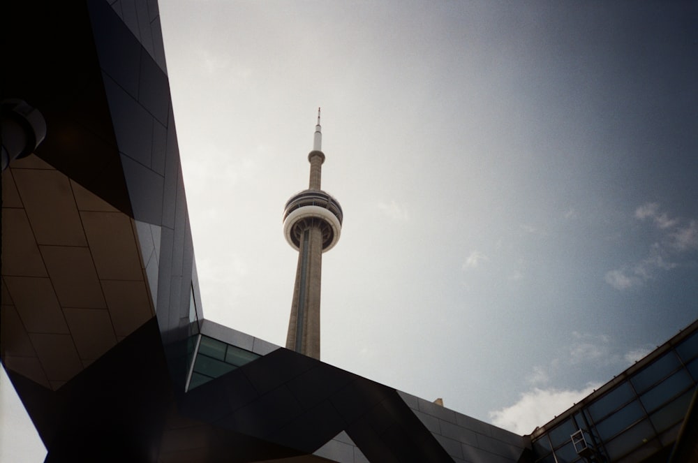 a tall building with a very tall tower in the background