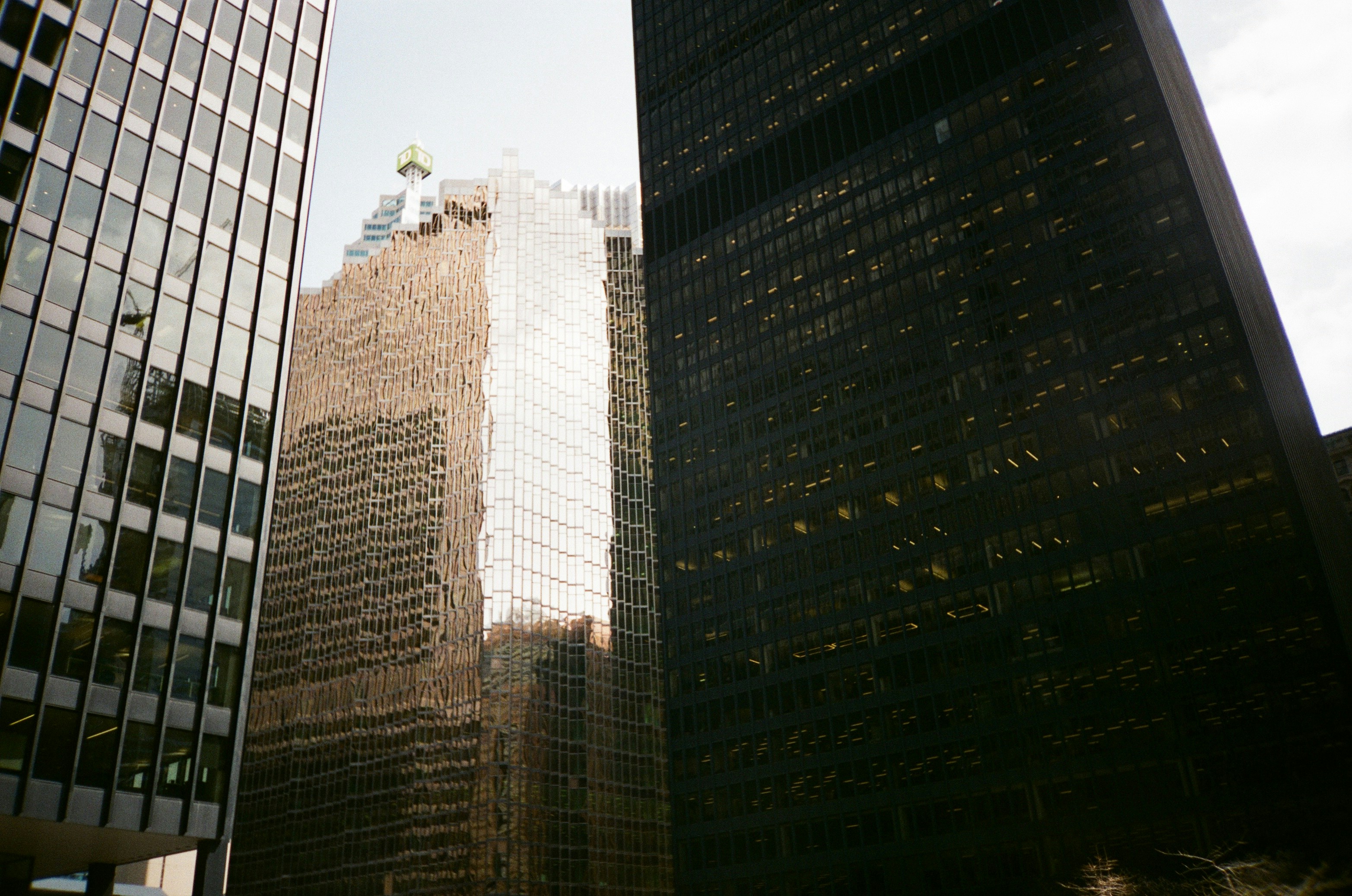 a couple of tall buildings sitting next to each other