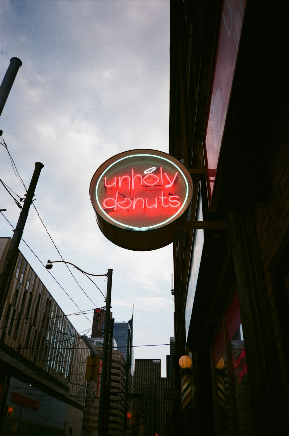 a neon sign for a restaurant on the side of a building