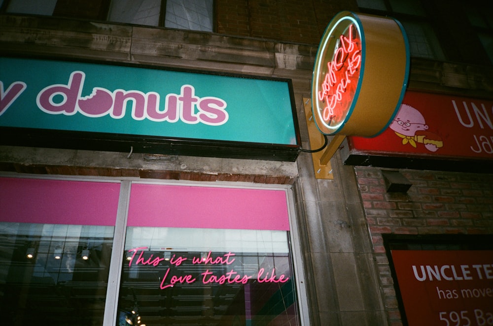 a neon sign that is on the side of a building