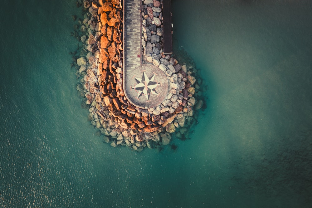 an aerial view of a pier with a compass on it