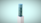 A stylized 3D-rendered object resembling stacked translucent cylinders in varying shades of blue and green, positioned vertically on a white pedestal against a light teal background.