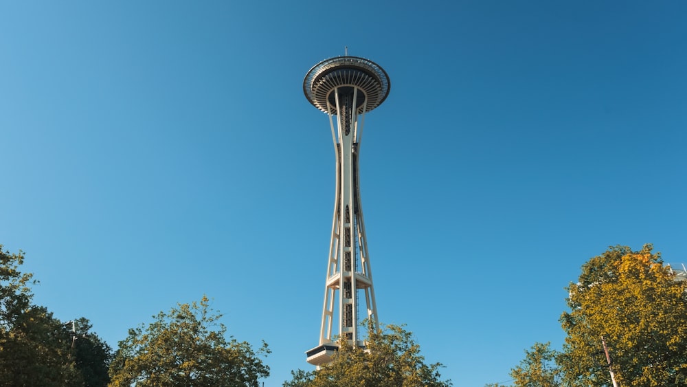 a tall tower with a clock on the top of it