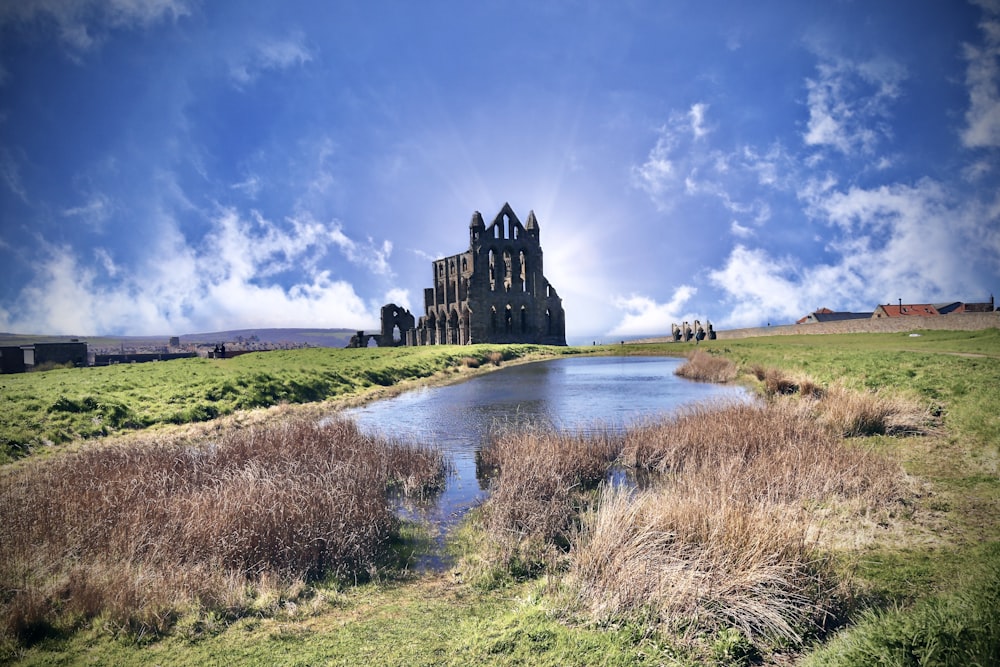 a large building sitting on top of a lush green field