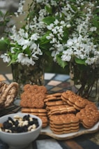 Display of assorted cookies and biscuits arranged on rustic trays.