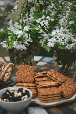 Corporate branded cookies arranged in a minimal, airy setting with subtle sage details.