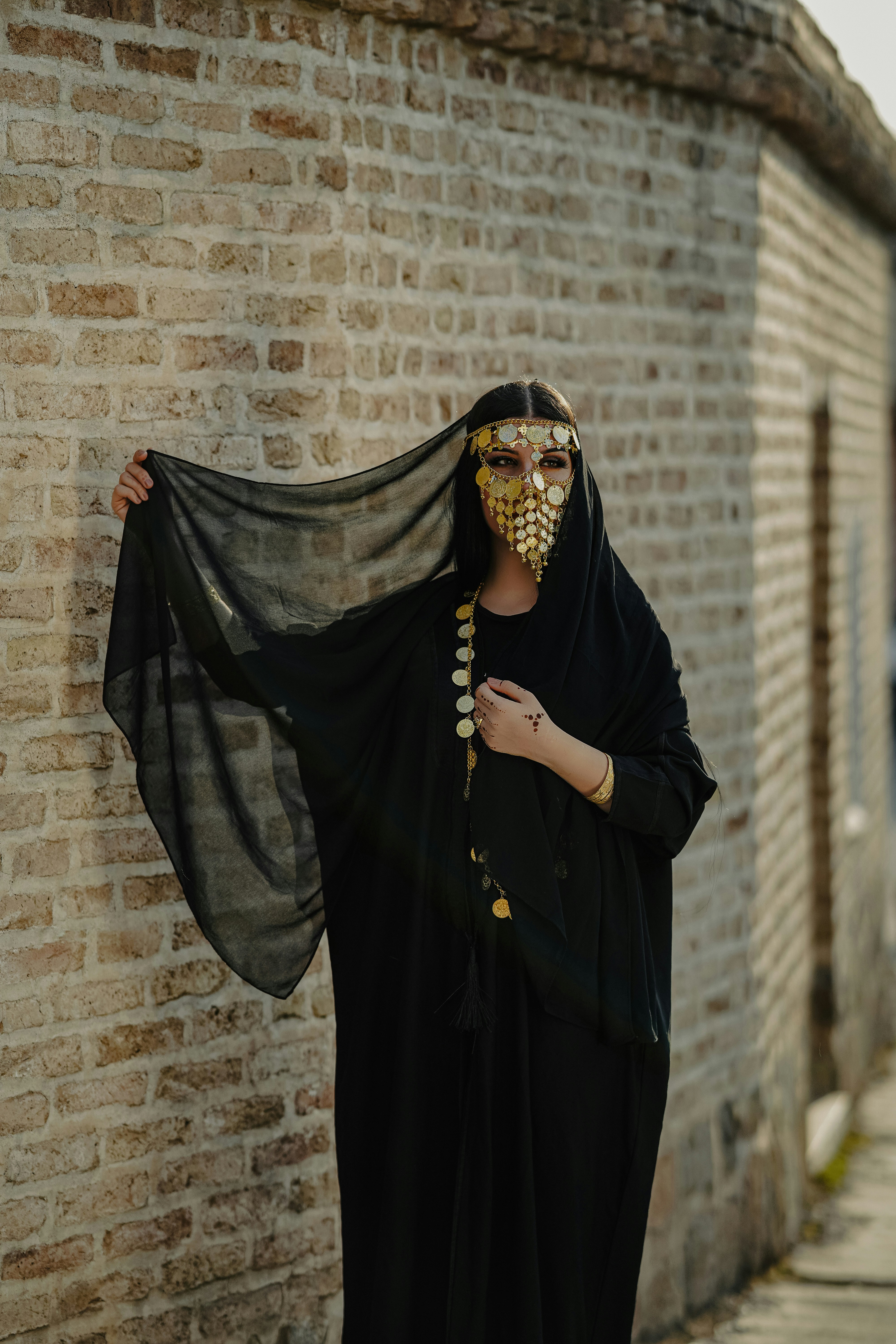 A woman wearing a mask and a black dress photo – Free Fashion Image on ...