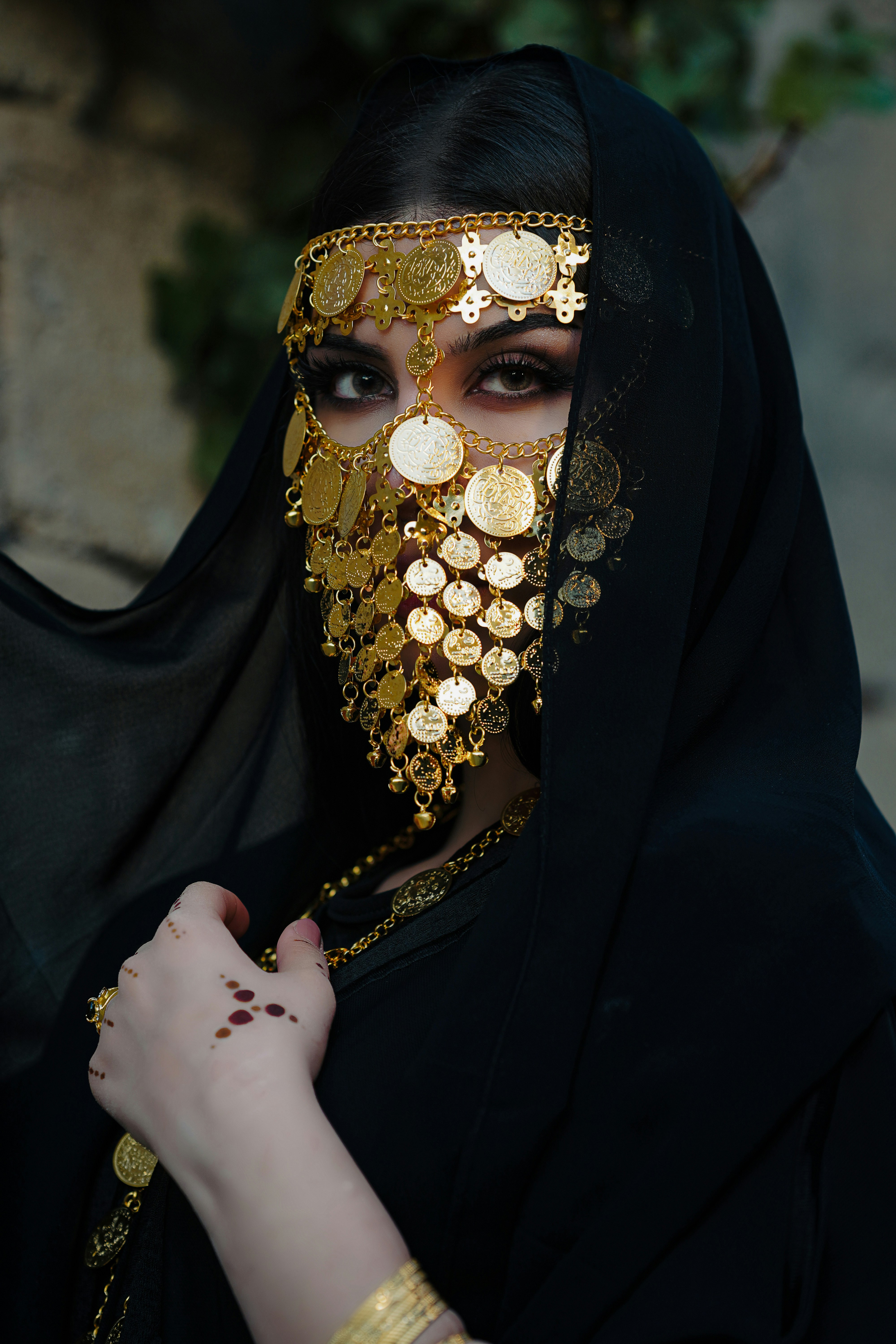 A woman in a black veil with gold coins on her face photo – Free Woman  Image on Unsplash