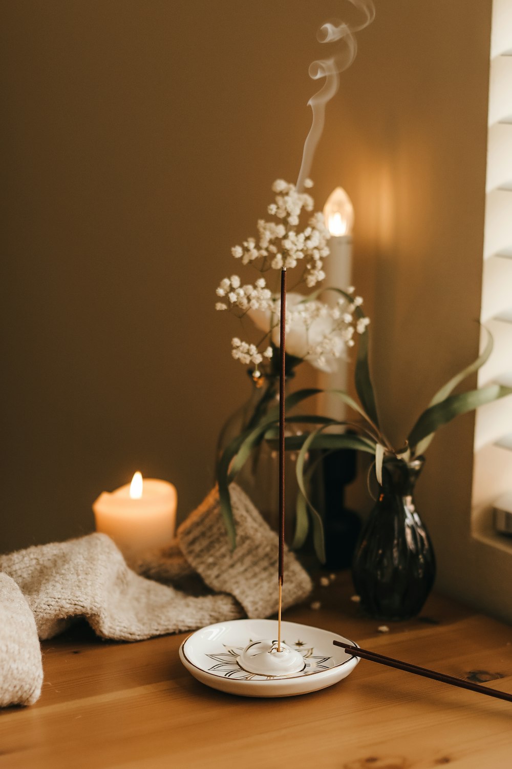 a white plate sitting on top of a wooden table