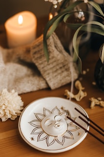 A serene incense setup with soft glowing candles.